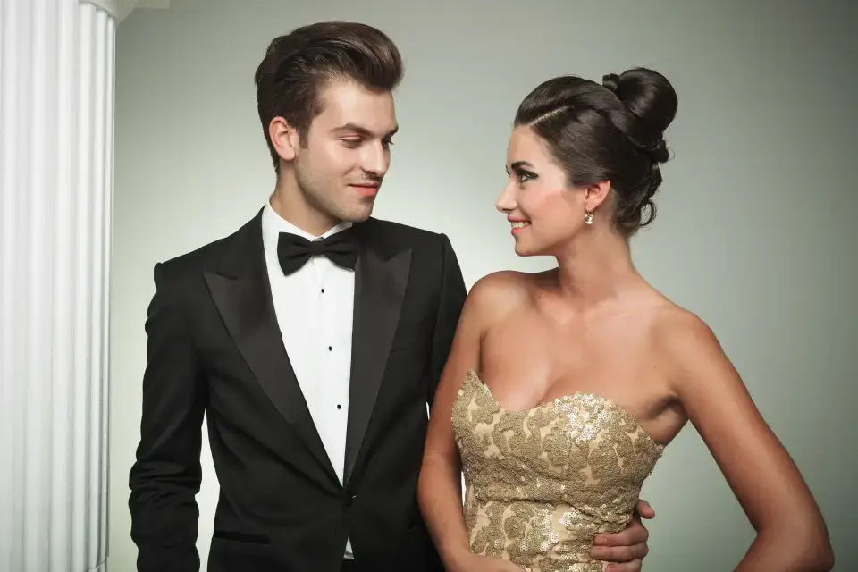 Elegant couple in formal attire.